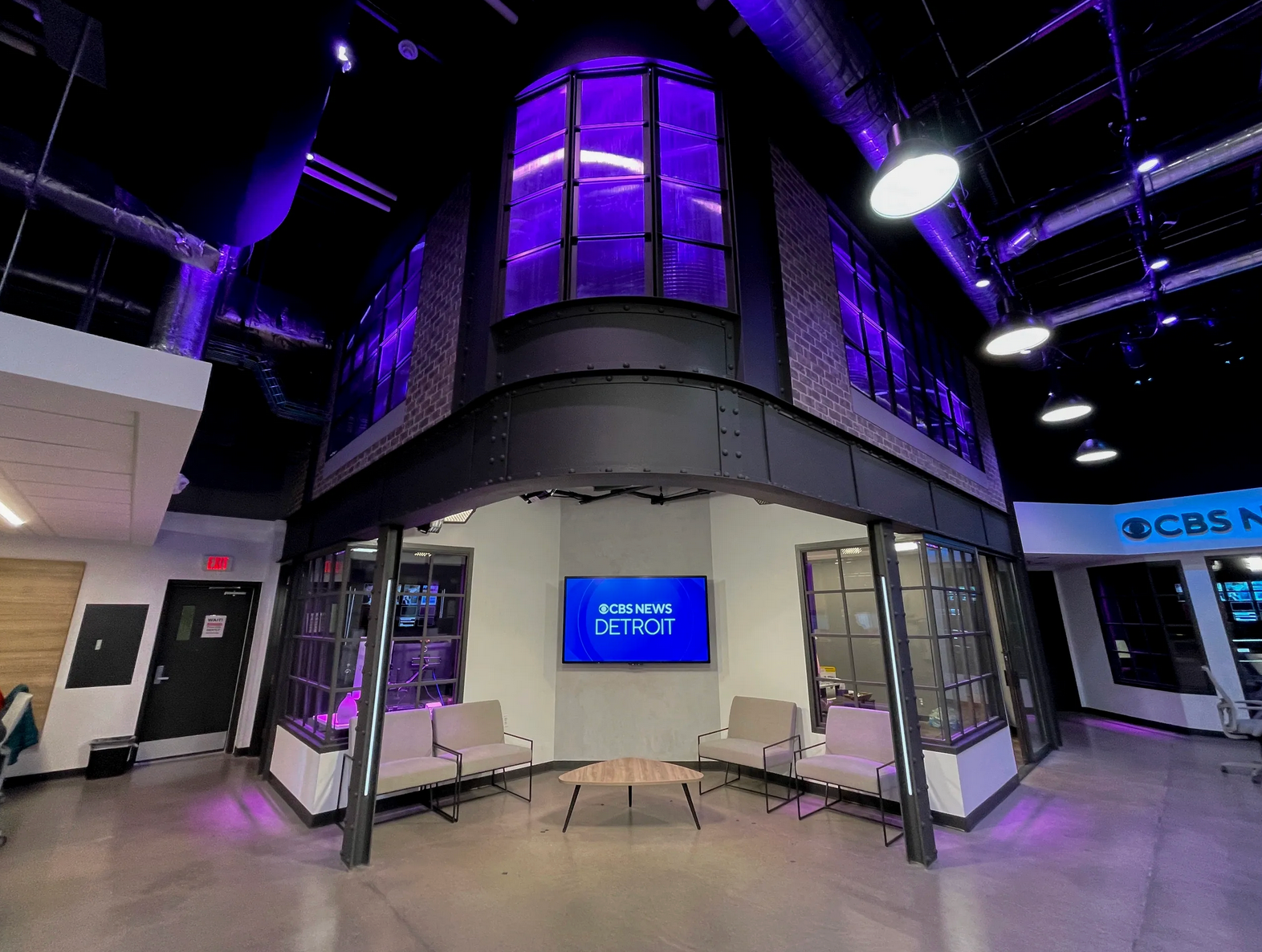 CBS News Detroit studio with dark steel columns, riveted panels and purple accent lighting