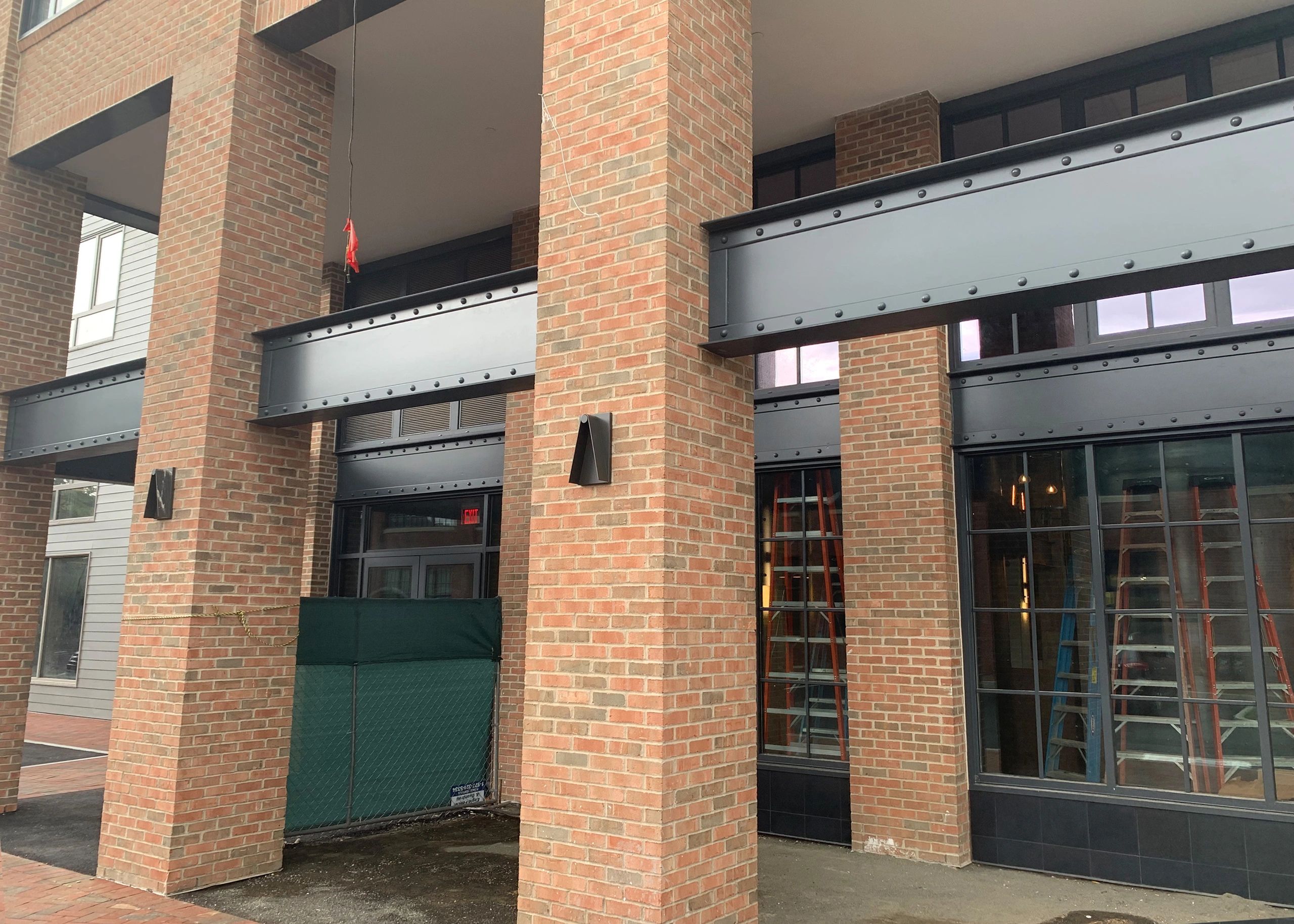 Exterior riveted I-beams installation