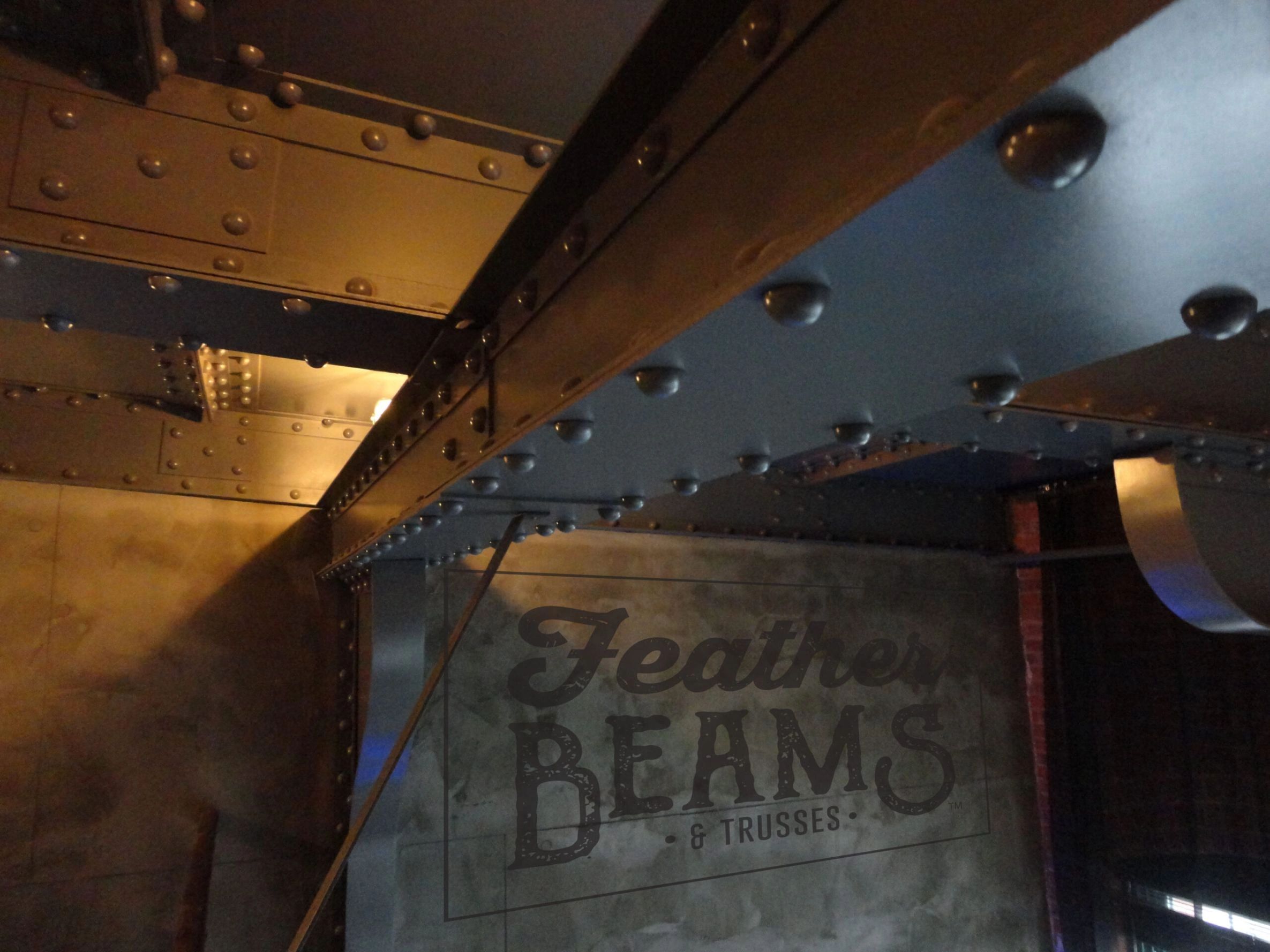Residential ceiling with Featherbeams faux steel beams